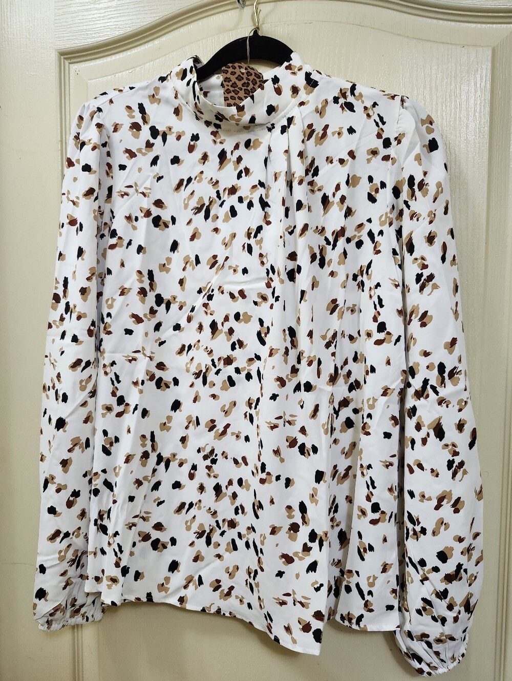 White Leopard Print Blouse with a Sophisticated Mock Neck Design
